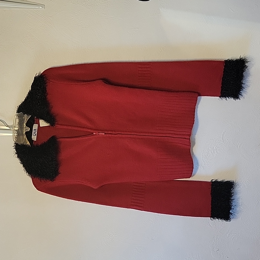 Red zip up cardigan with black fur collar